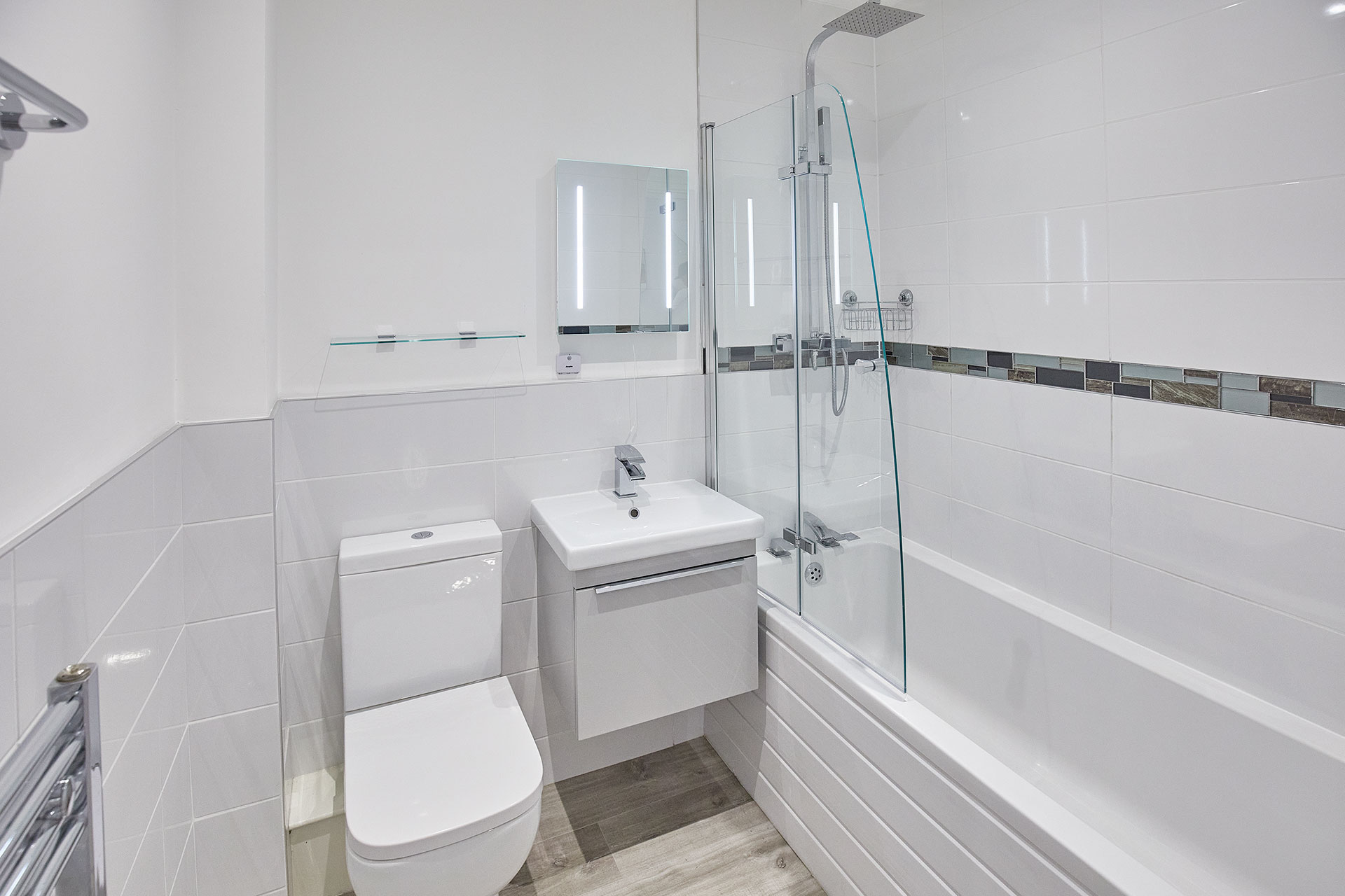 Main bathroom with bath and shower